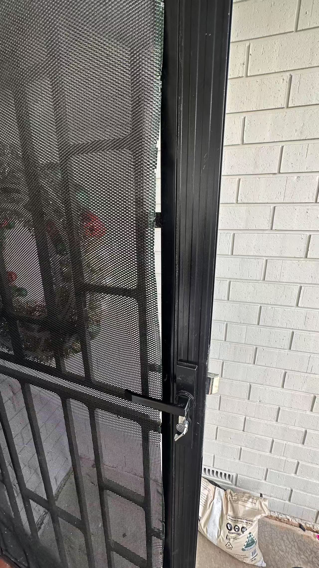 Existing screen-door edge and latch-side frame out of alignment before the recorded repair